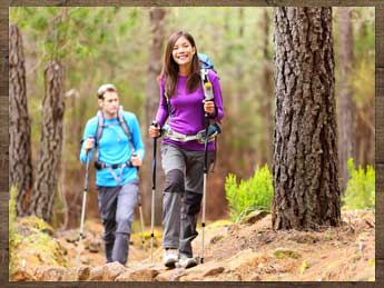 A couple hiking in the forest.