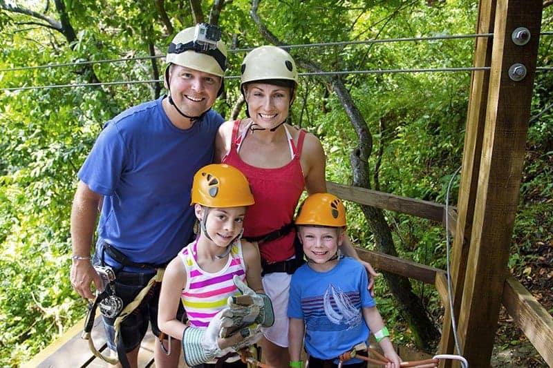 Happy family ziplining in Gatlinburg.