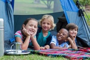 A group of kids tent camping in the Smoky Mountains.