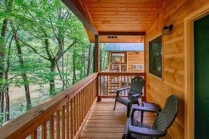 A porch overlooking the river at a cabin at Pigeon River Campground.
