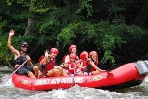 A family going white water rafting near Pigeon River Campground.