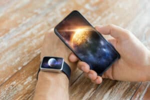 phone and watch with solar system photos